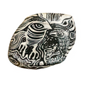 Hand-painted decorative stone with bold black and white abstract face design, unique home decor accent piece