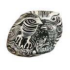 Hand-painted decorative stone with bold black and white abstract face design, unique home decor accent piece