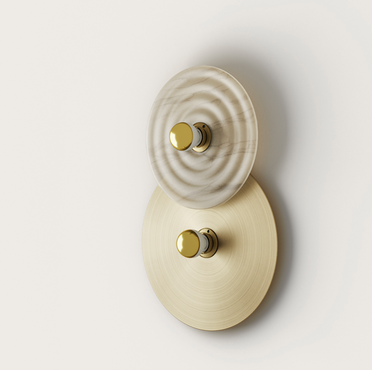 Wall lamp with stacked white marble ripple-patterned and brushed brass circular elements, each centered with a gold knob.