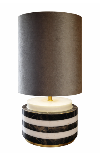 Elegant table lamp with a dark gray velvet shade and a cylindrical black and white striped marble base with gold accents.