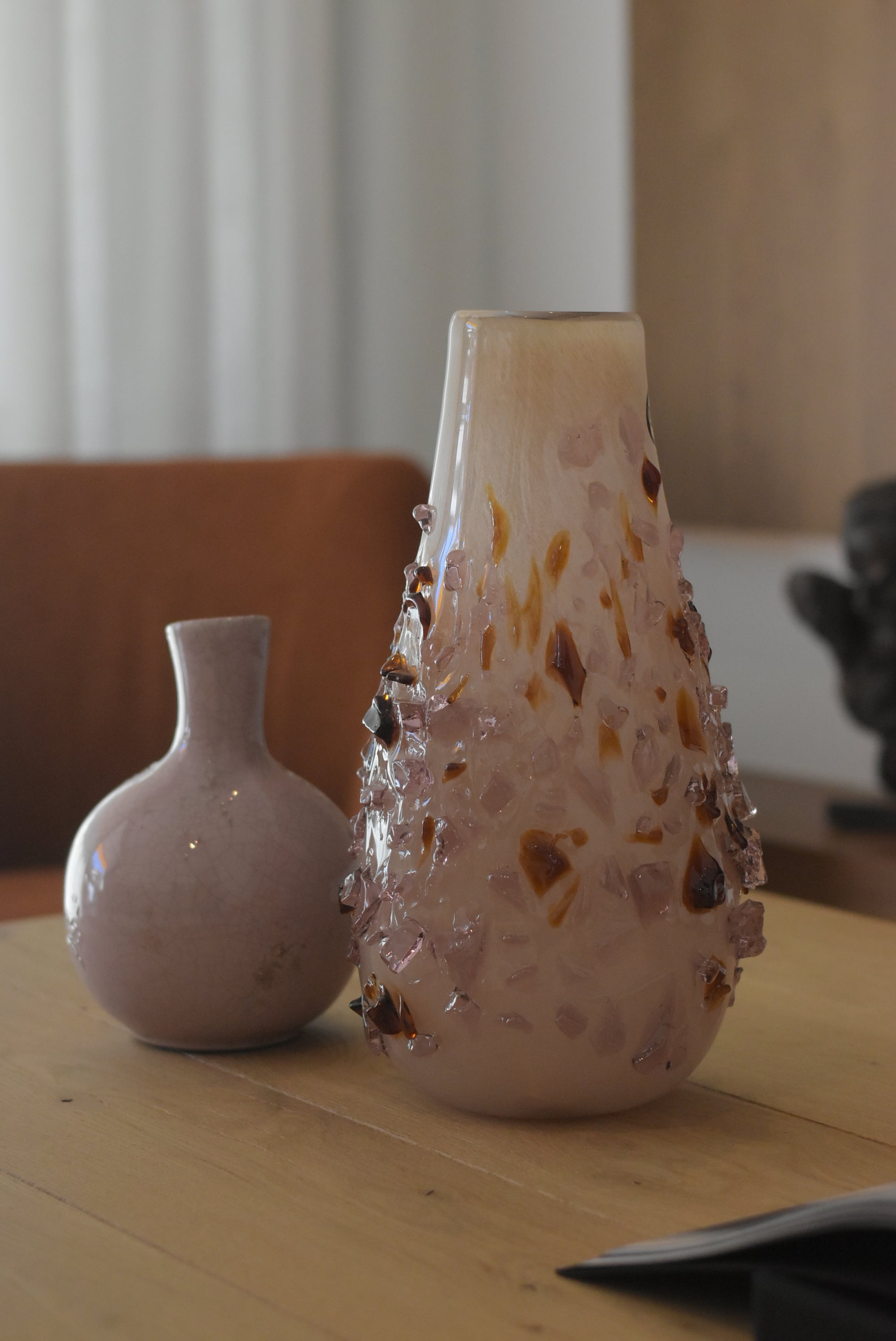 Decor quartz vase by Object and Story, accented with decorative pink and brown glass fragments.
