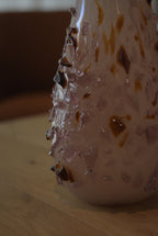 Hand-blown quartz vase by Object and Story with applied fragments of brown and lavender glass.