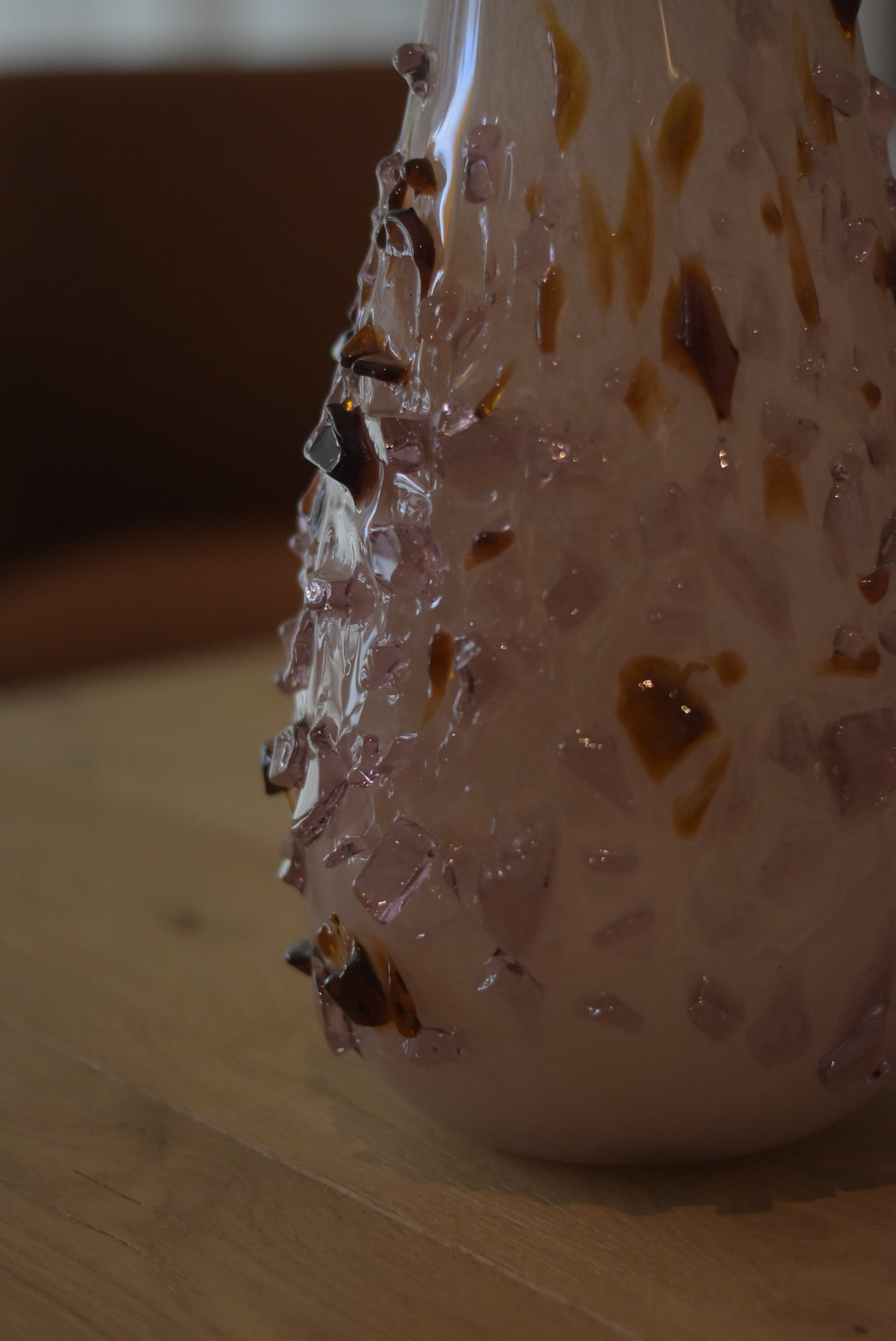 Hand-blown quartz vase by Object and Story with applied fragments of brown and lavender glass.