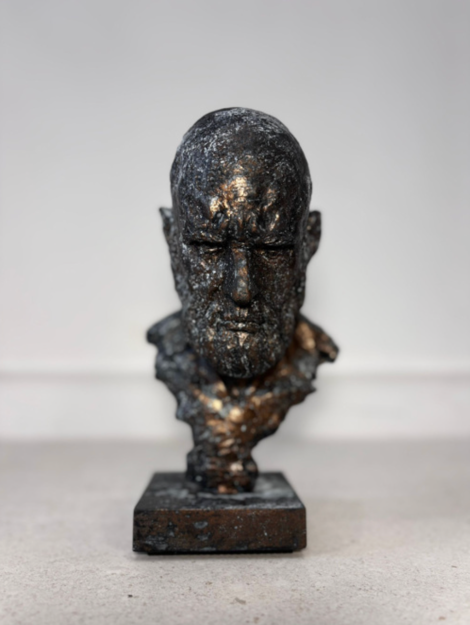 Textured bronze bust sculpture with weathered finish, decorative object for modern interiors