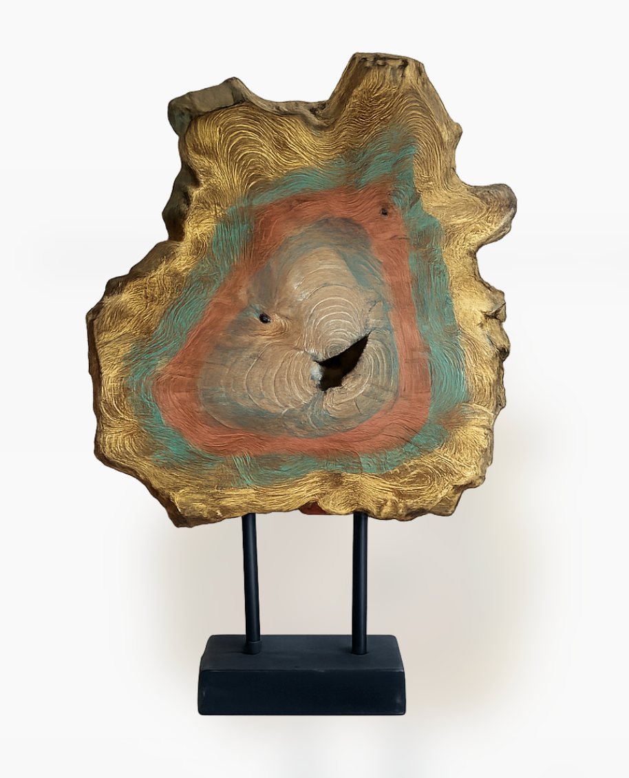 Colorful, gold-accented wood deco piece with concentric rings of teal, orange, and beige, mounted on a black stand.
