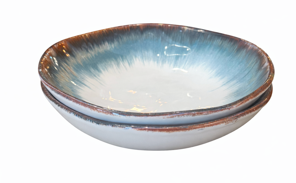 Set of two indigo plates with brown rims and white centers, stacked, featuring a glazed, brushstroke pattern.