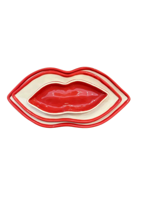 Set of three nested red and cream lip-shaped dishes with a glossy finish.