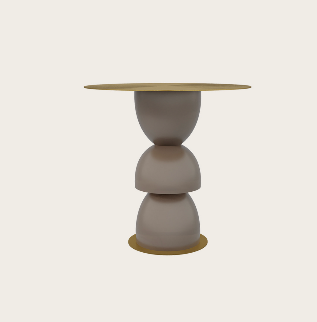 Metric side table with a stacked sculptural taupe base and round gold metallic top and bottom accents.