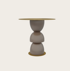 Metric side table with a stacked sculptural taupe base and round gold metallic top and bottom accents.