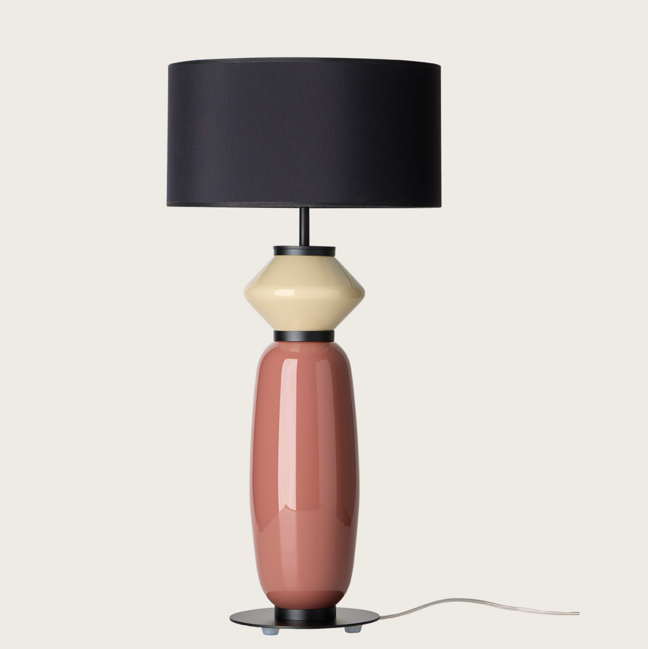 Modern ceramic table lamp with black shade, beige and terracotta base, sleek design for contemporary interiors