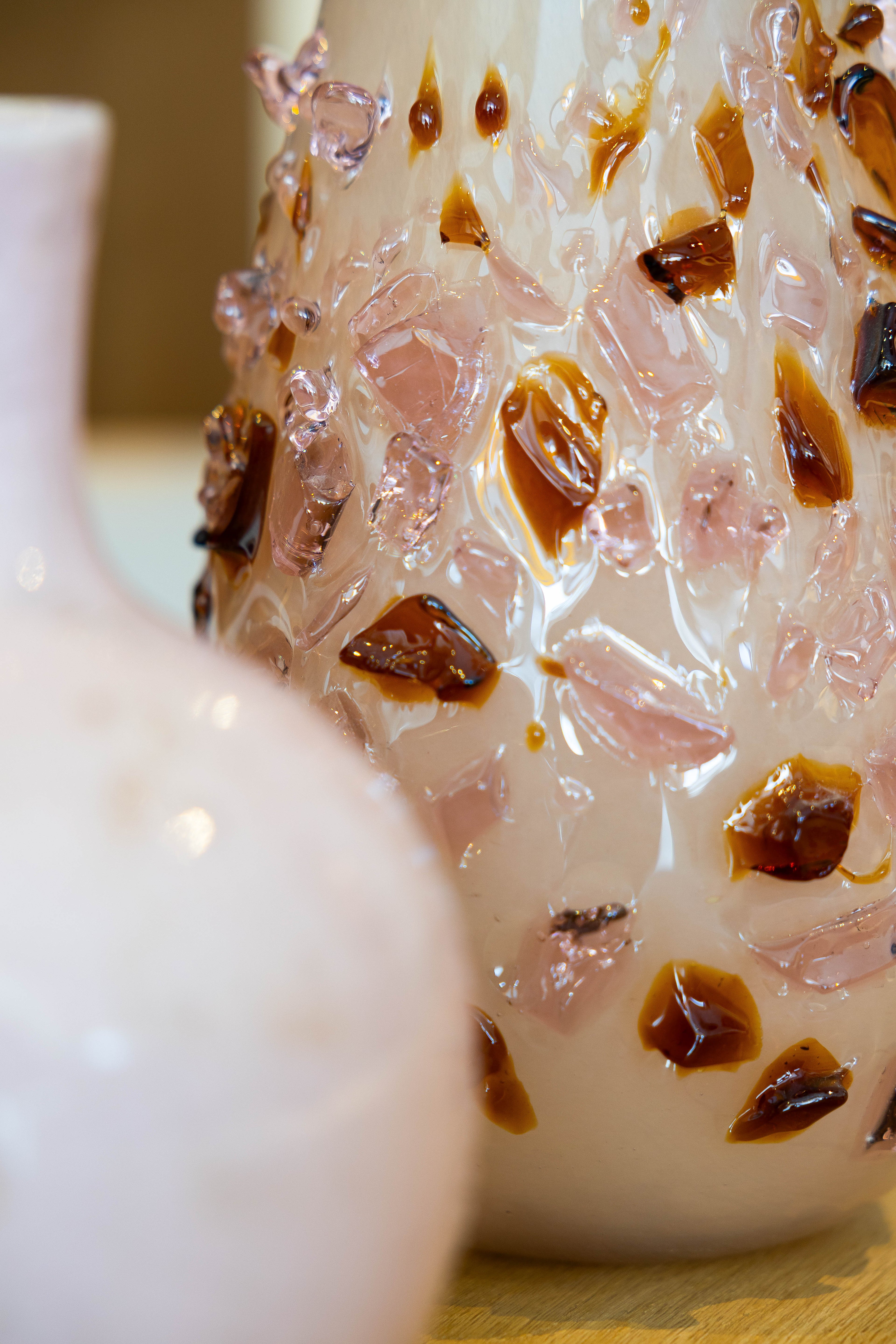 Decorative quartz vase by Object and Story, featuring clear resin and embedded pink and brown chips.
