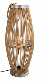 Rafia floor lamp made of vertical natural wood sticks, with a metal top, rope handle, and an exposed glowing bulb.