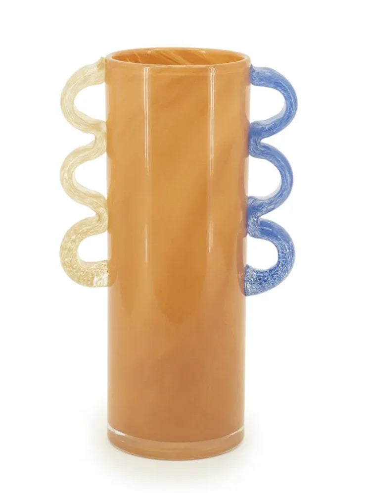 Orange glass vase by Object and Story with wavy yellow and blue handles.