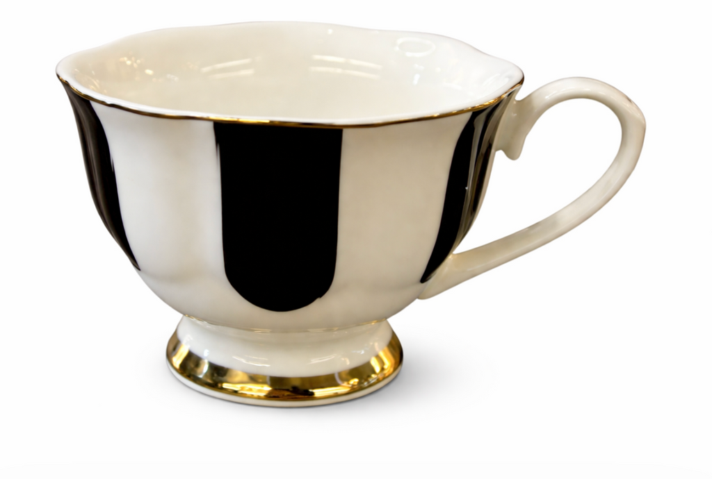White porcelain tea cup with black vertical stripes, gold trim on the rim, and a footed base.