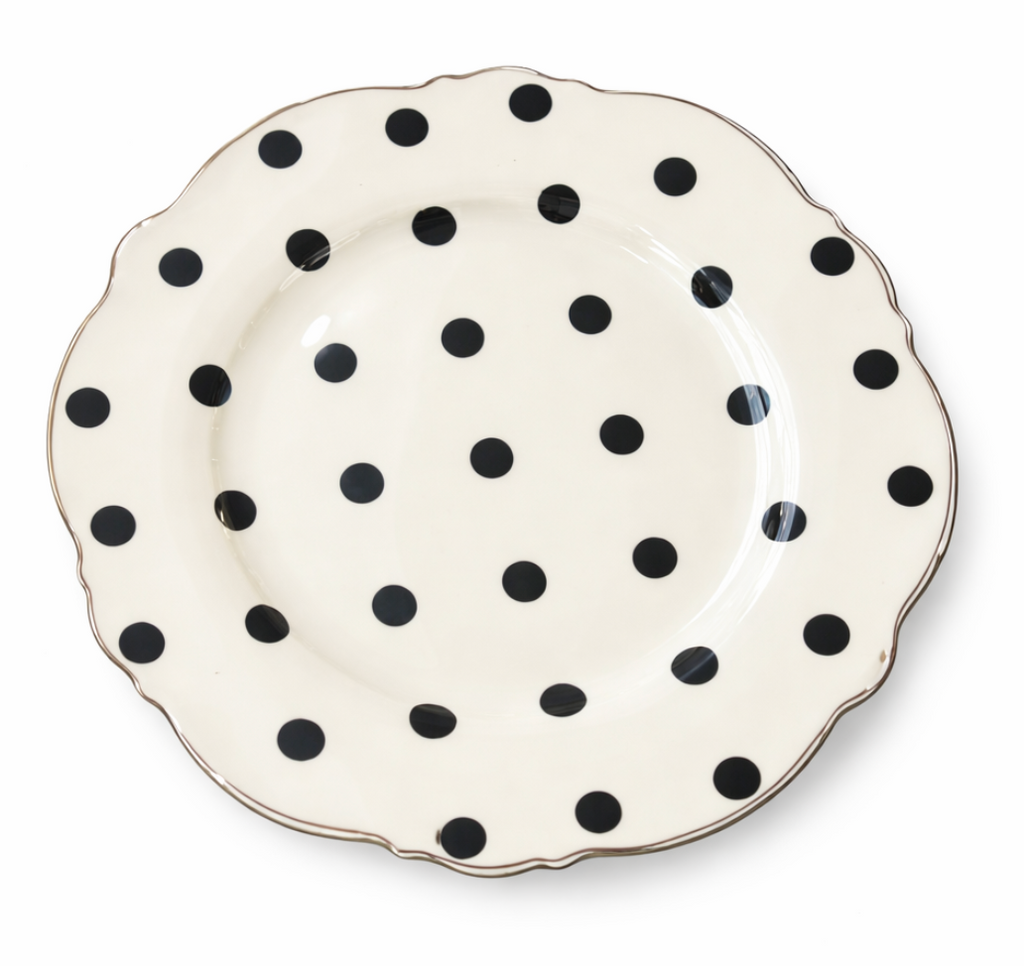 Dame Layered Tea Cup Set saucer, white with black polka dots and a scalloped gold rim.