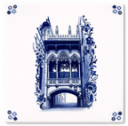 White ceramic tile featuring a blue illustration of a gothic bridge and ornate floral scrollwork, with corner motifs.