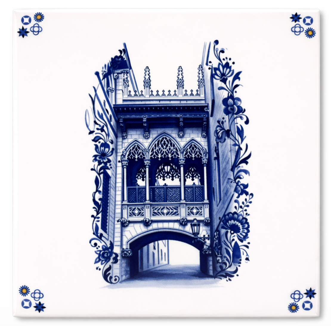White ceramic tile featuring a blue illustration of a gothic bridge and ornate floral scrollwork, with corner motifs.