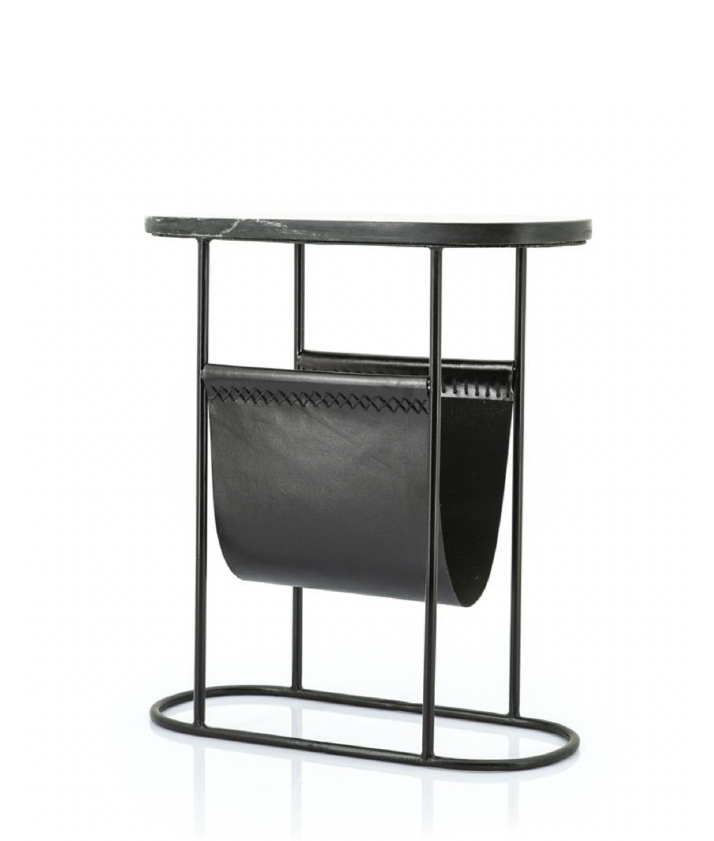 Black metal side table with an oval dark marble top and a black leather magazine holder featuring decorative stitching.