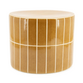 Mustard side table by TileTastic, with a cylindrical shape and vertical rectangular tiles separated by white grout lines.