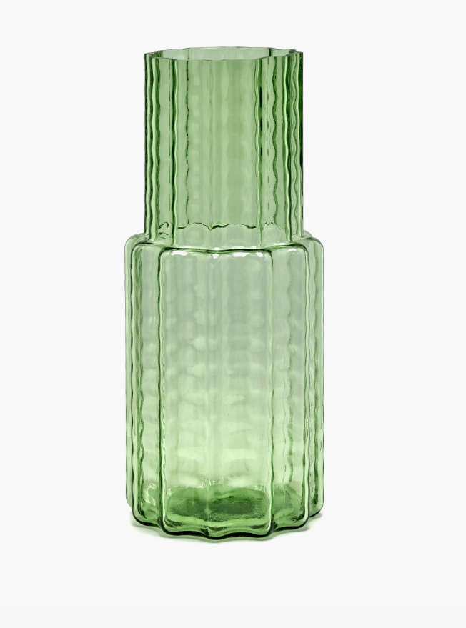Two-tiered green glass vase with a vertical waves pattern.