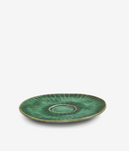 Green cappuccino saucer by Verde Lanza with radiating dark green stripes, a lighter edge, and a central cup indentation, angled.