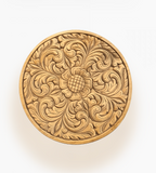 Round wood tray with intricate floral and scrollwork carving, in a natural wood tone on a white background.