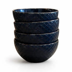 Five dark blue bowls, stacked, with a diamond embossed texture.