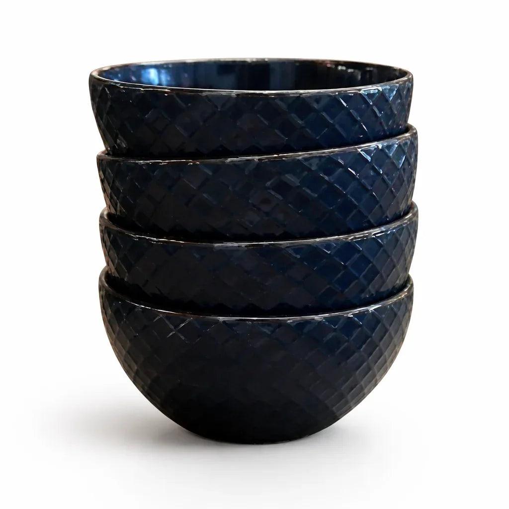 Five dark blue bowls, stacked, with a diamond embossed texture.