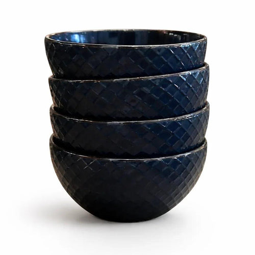 Five dark blue bowls, stacked, with a diamond embossed texture.