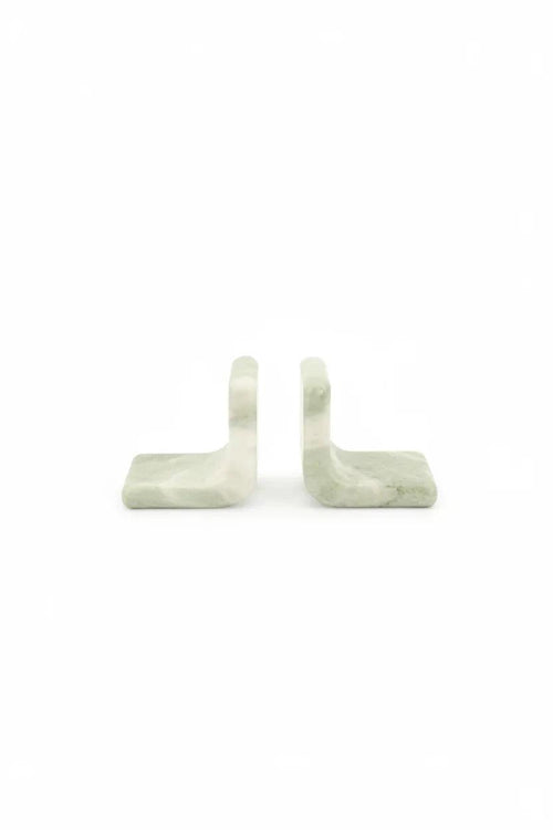 Two light green marble bookends, L-shaped with white veining.