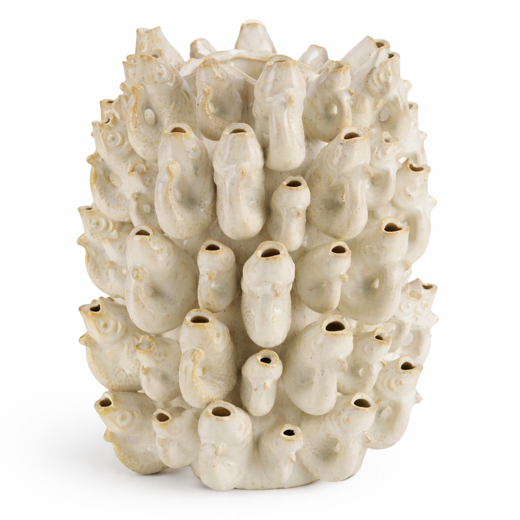 White ceramic Borja vase by Object and Story with protruding tubes and a mottled surface.
