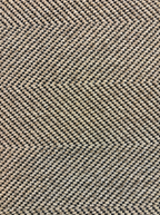 Linen rug with a two-tone beige and dark brown herringbone weave.