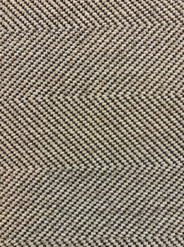 Linen rug with a two-tone beige and dark brown herringbone weave.