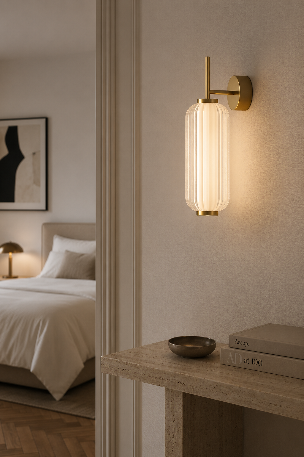 Modern brass wall sconce with ribbed glass shade, warm ambient lighting for bedroom or hallway decor