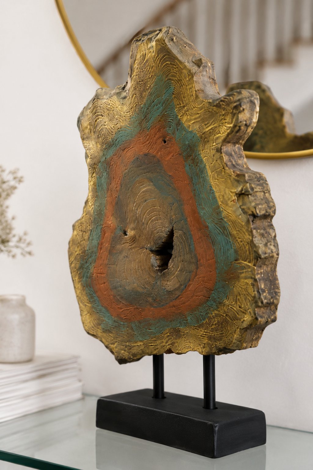 Hand-painted wood slice sculpture with gold, teal, and rust hues on black stand for modern home decor