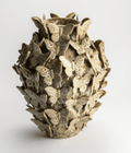 Light brown ceramic vase by Isaa Colares, heavily textured with numerous small butterflies.