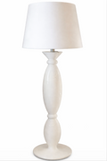 White floor lamp with a glossy, hourglass-shaped base and a conical shade.