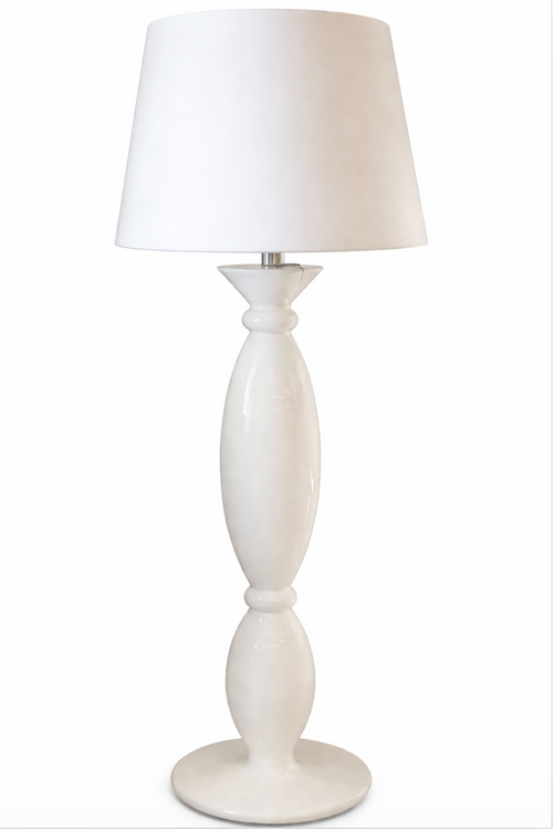 White floor lamp with a glossy, hourglass-shaped base and a conical shade.