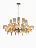 Gold-toned hanging lamp with amber glass cylindrical shades in a radiating, multi-tiered design.