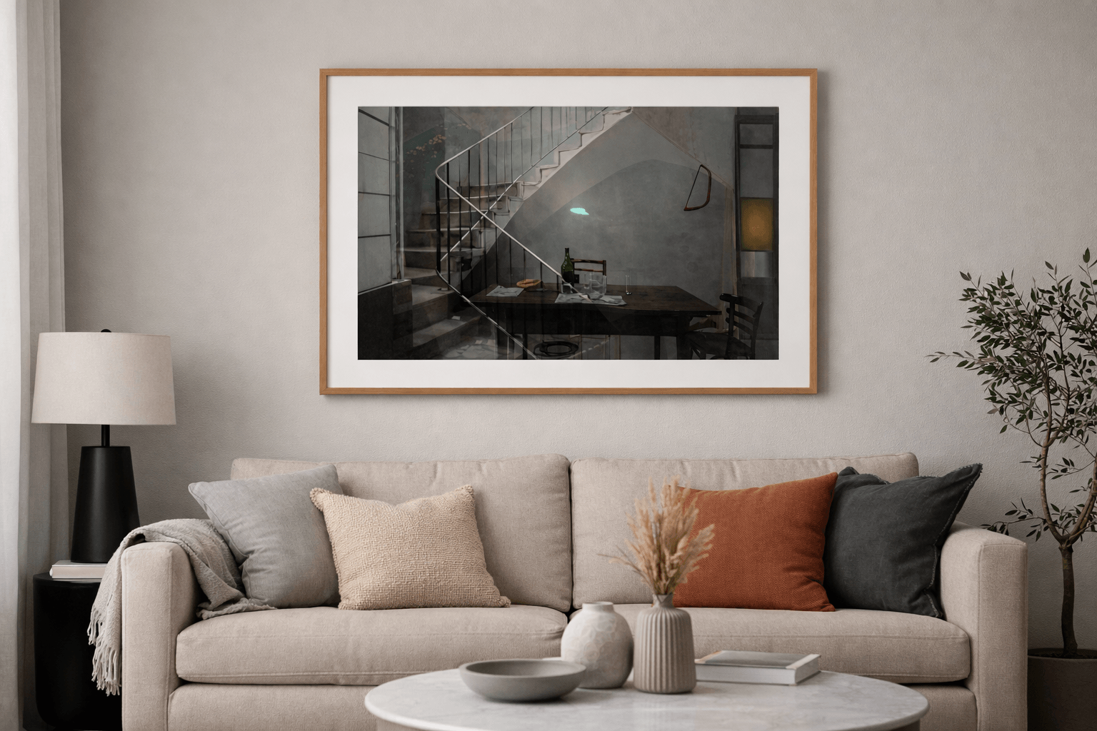 Desván painting by Manuel Cohen depicting an interior staircase scene, framed in light wood, in a modern living room.