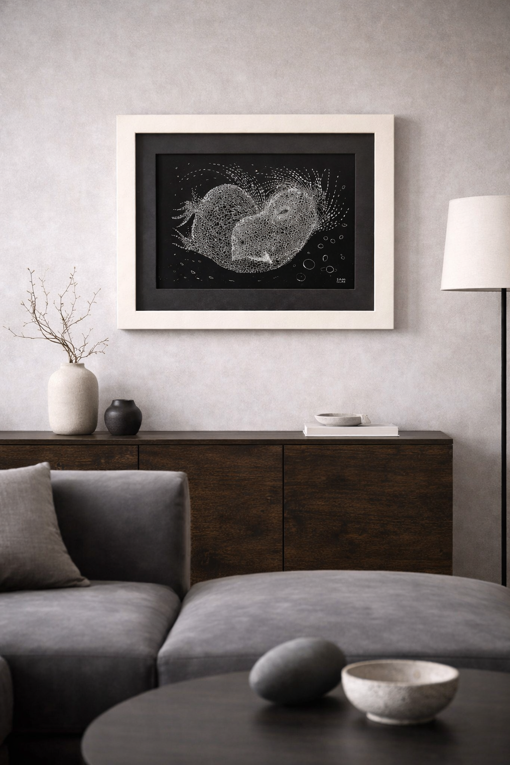 Mirlo Artwork in a light frame, featuring intricate white abstract patterns on a black background.
