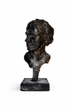 Orpheus bust sculpture in dark, textured bronze with a distressed finish, viewed in side profile on a dark base.
