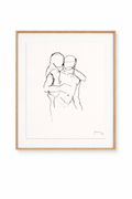 A framed people painting featuring a minimalist black line drawing of two embracing figures with an artist's signature, in a light wooden frame with a white mat.