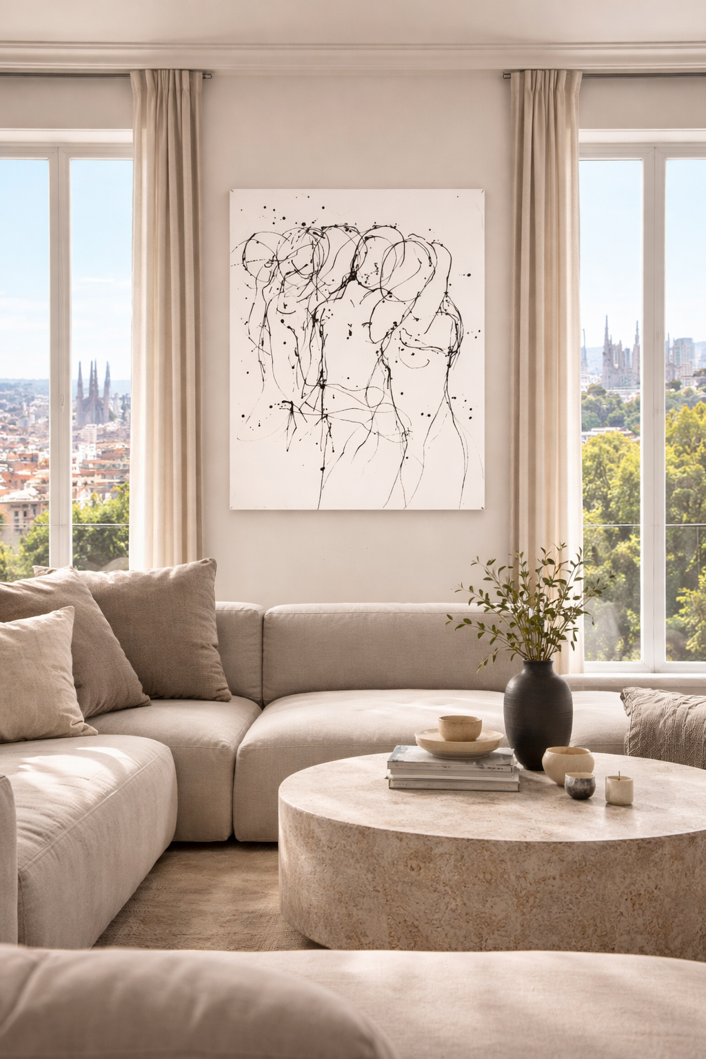 Abstract Whisper Lines painting with black line figures and splatters on a white canvas, hung above a light sofa.